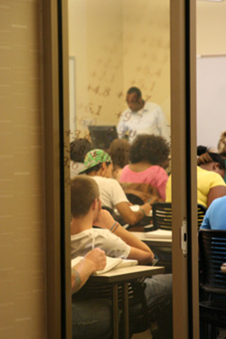 photo of a professor and students in a class
