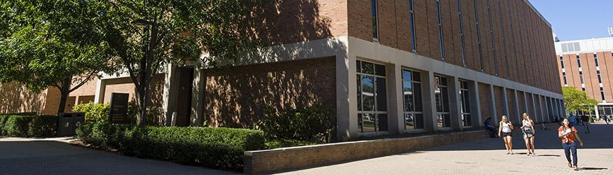 photo of students walking outside on campus and the exterior of oelman hall