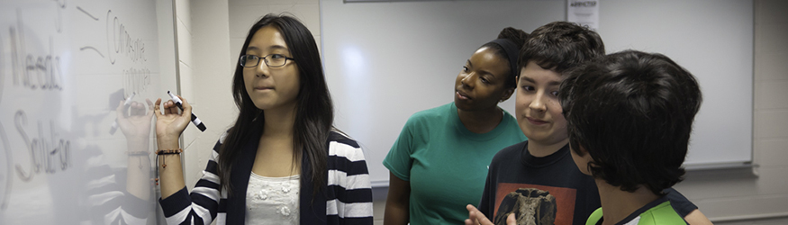 photo of a teacher and young students