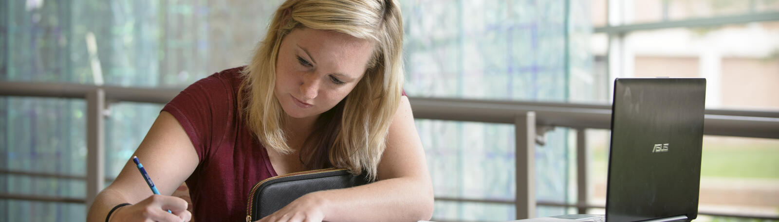 photo of a student sitting at a table in fawcett hall