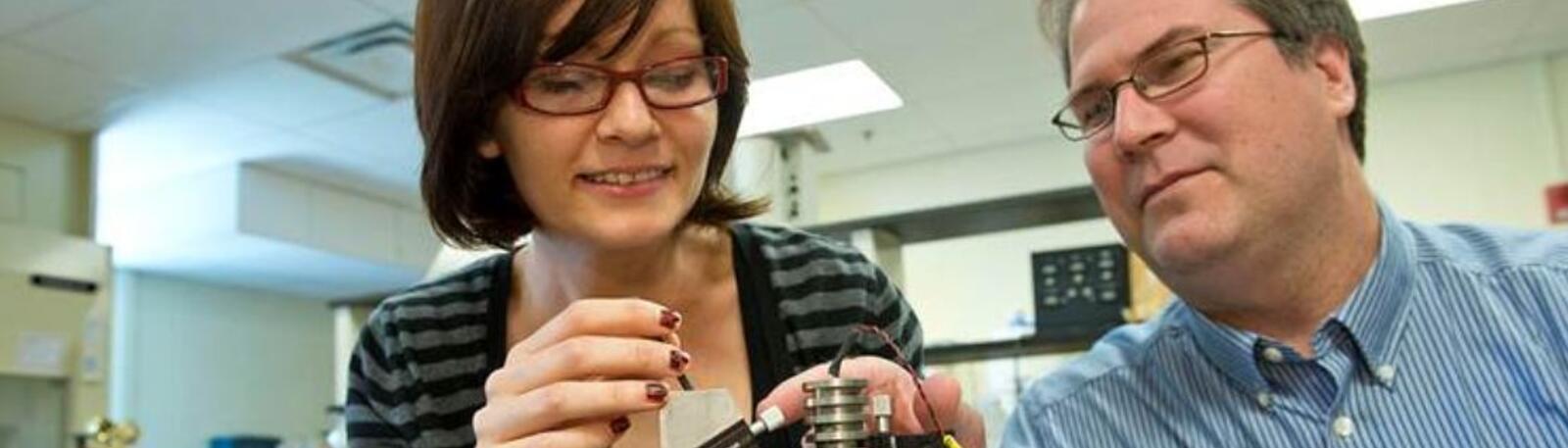 photo of a student and instructor in a lab