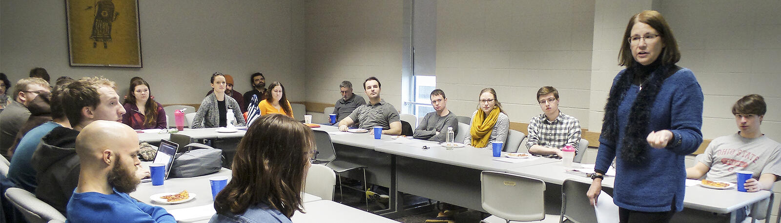 photo of a professor and students in a classroom 